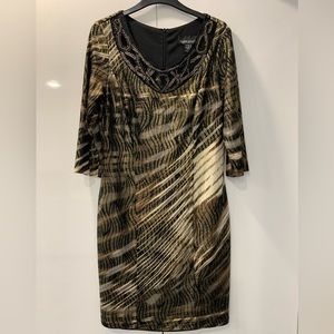 Frank Lyman Design, dinner/party dress with beading around the neckline!